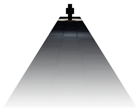 A long stone floor running away into darkness. At its far end, under a single lamp, stands a small dark figure.